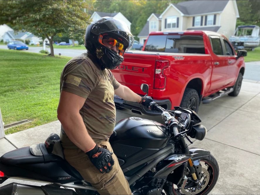 Travis Boles seated on his motorcycle